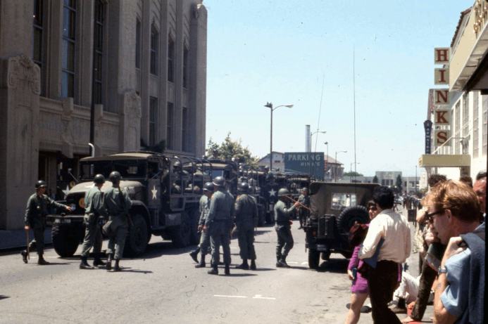 Picture of military convos and guardsmen outside Berkeley library